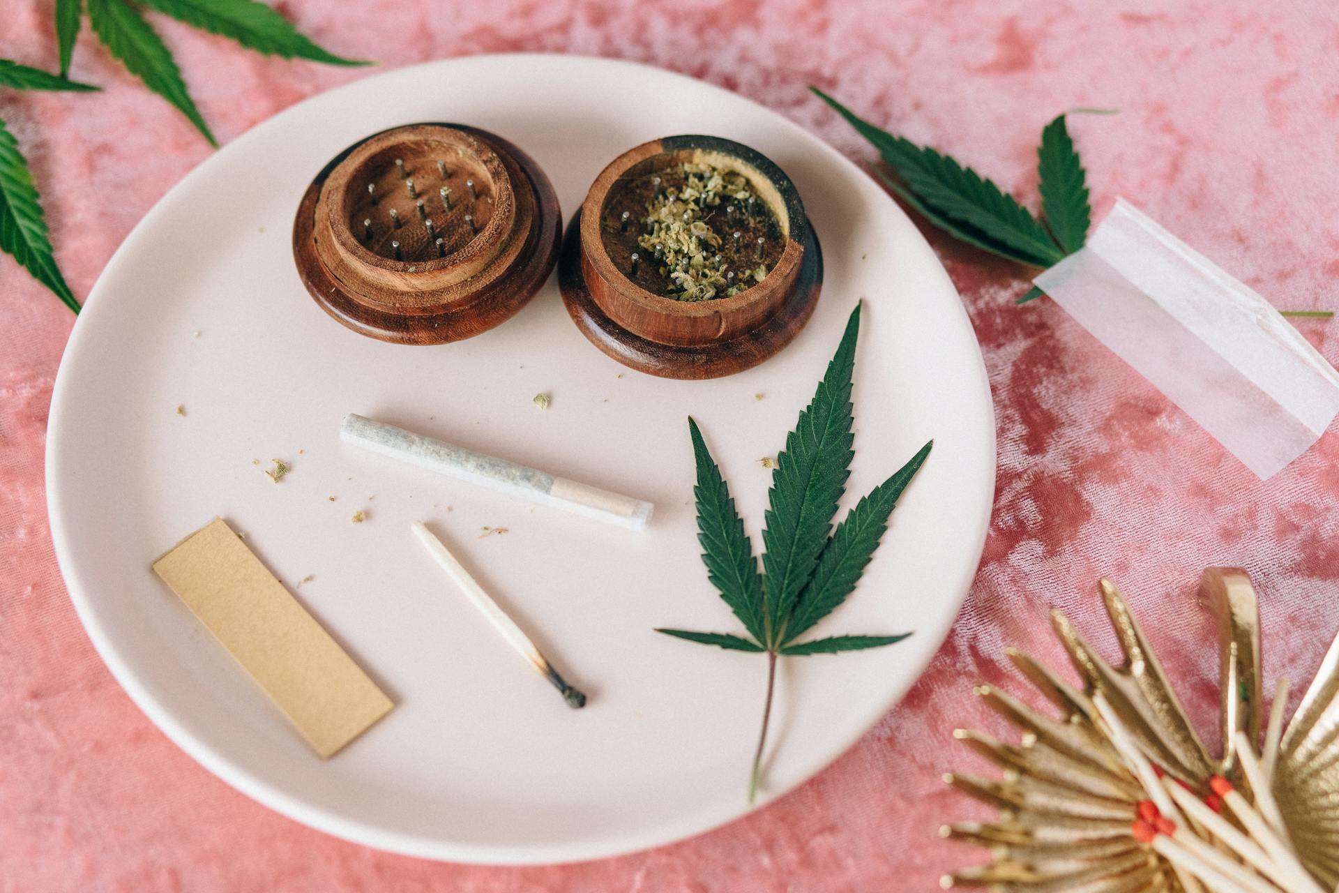 Pre-rolled cannabis joints arranged with loose flower beside them — single, multi-pack, and infused pre-rolls at Purple Buds Dispensary in Jackson Heights, Queens